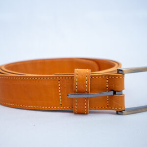 Mocha brown belt with silver buckle. Neat stitch work showing at front view