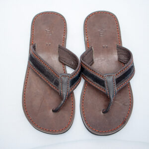 Front view of brown leather sandals showing detail of red thread work