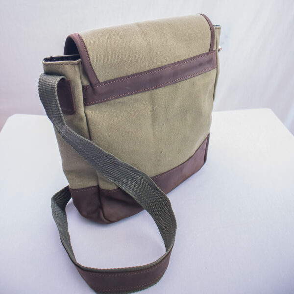 Back view of canvas and leather bag showing detail of leather decor and finishing