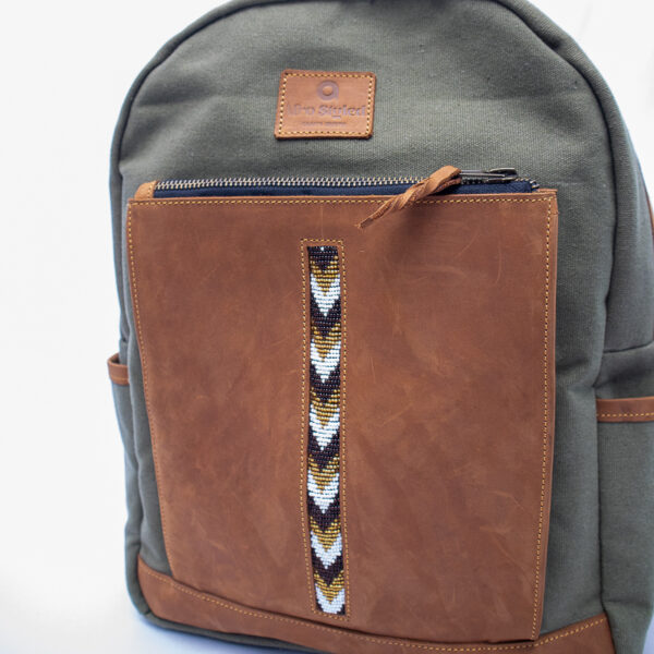 Close up of bag pack showing beaded detail on outer pocket