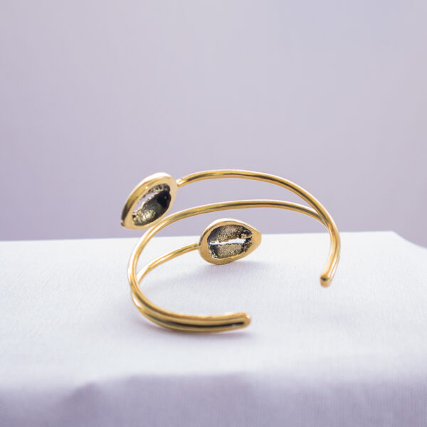 Back view of the elegant cowrie shell inspired African bracelet for women