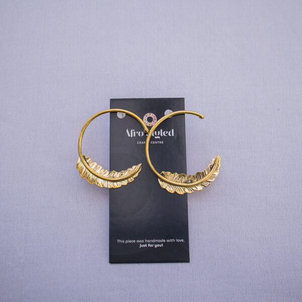 Feather detailed loop earrings fit for everyday wear. Simple and elegant style for women.