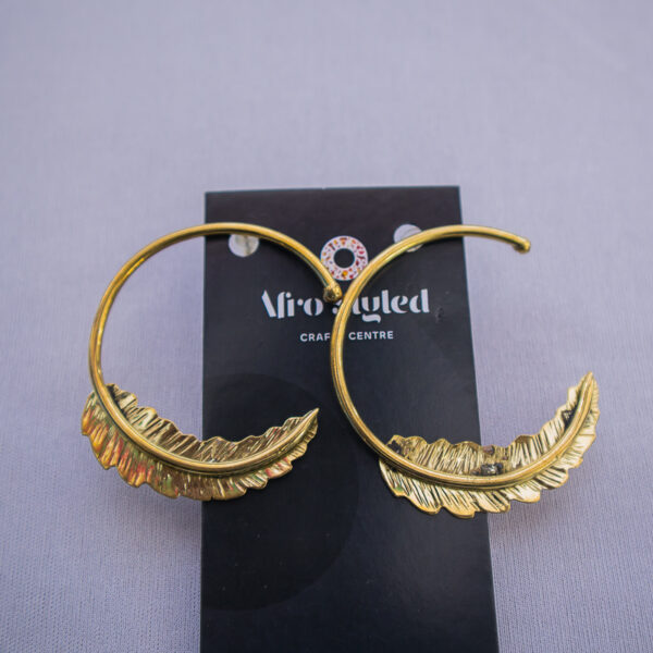 Feather detailed loop earrings fit for everyday wear. Simple and elegant style for women.