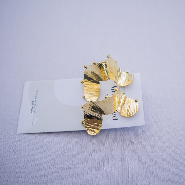Afrostyled large brass drop earrings with hammered texture and afrocentric flair