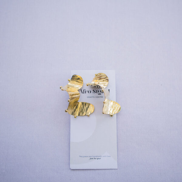 Afrostyled large brass drop earrings with hammered texture and afrocentric flair