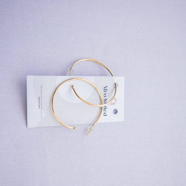 Minimalist brass loops with a polished finish. Medium size suitable for everyday wear