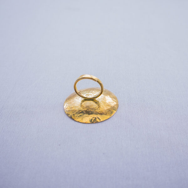 Rear view of the handmade brass statement ring with concave design and adjustable band.
