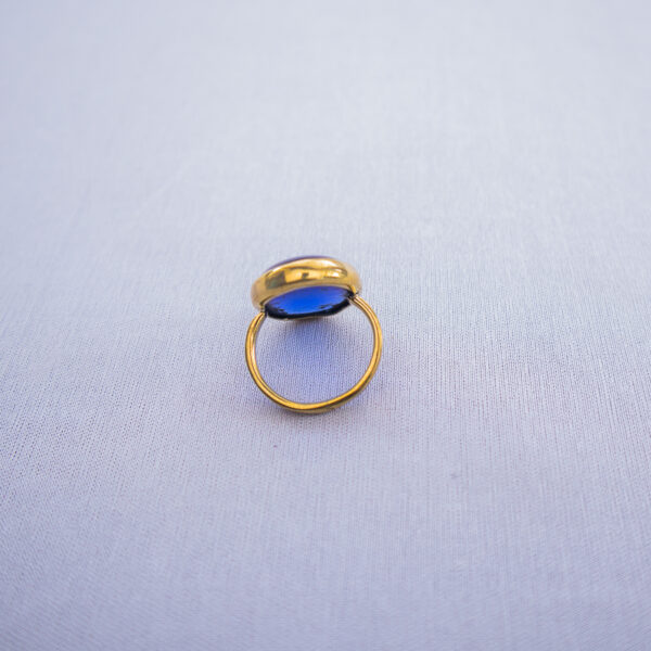 Ocean blue recycled glass on brass rings. Inspired by the blue sea and ocean water.