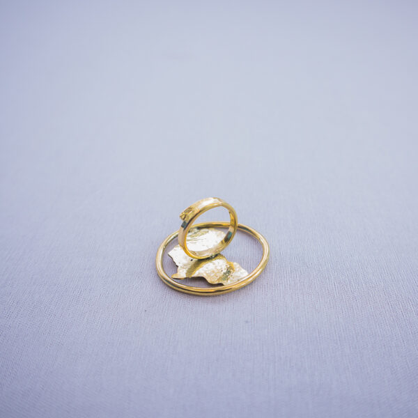 Brass statement ring featuring cutout Africa map design with a glossy finish