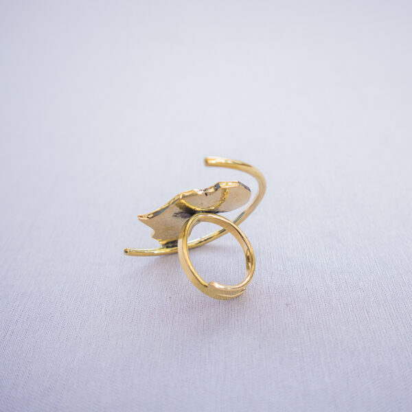 Side view of the adjustable Afrostyled statement ring with a geometric arc and bold Africa map detail