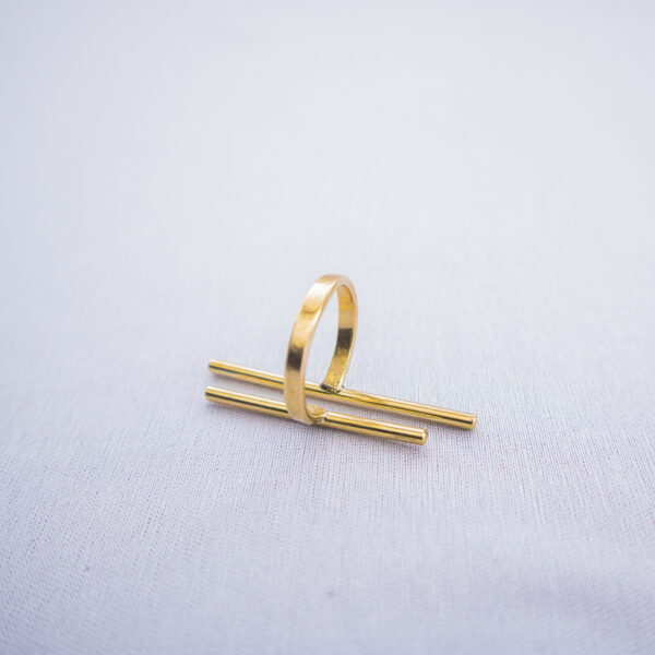 Rear view of the minimalist brass ring with twin parallel line design