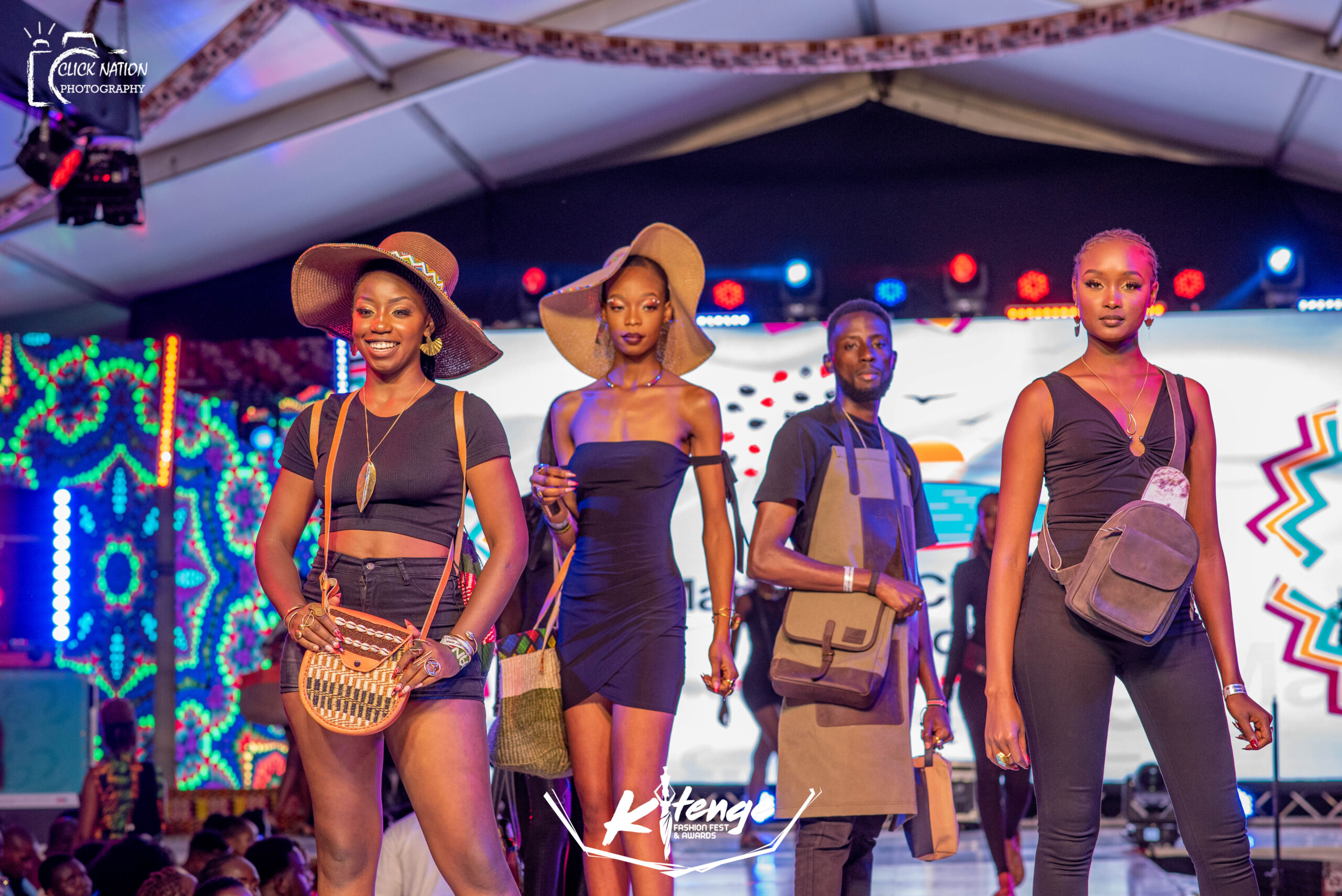 Bold,beautiful Afrostyled models posing with handcrafted sisal bags,leather bags,canvas bags and brass jewelry,highlighting vibrant african inspired fashion and craftmanship