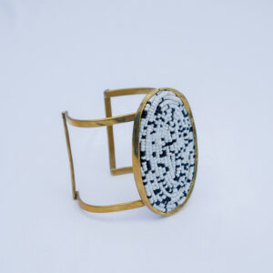 A bold handmade brass beaded bracelet with a mosaic beaded centre piece.