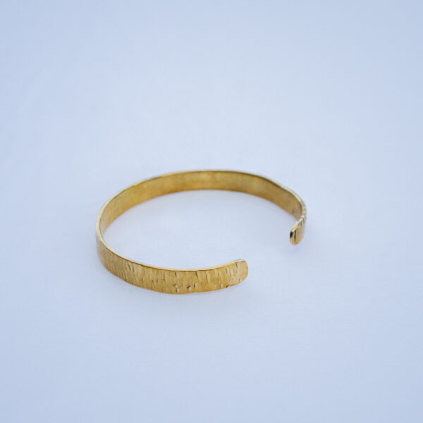 Handcrafted brass bracelet with a minimalistic design. Made from pure brass with a coarse finish.