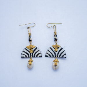 A pair of handcrafted dangling earrings. Made from bone with zebra pattern and delicate brass wire detail.