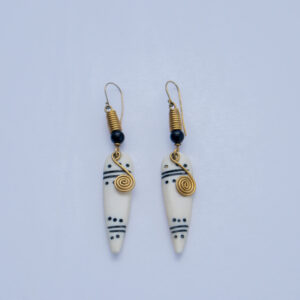 Beautiful bone earrings with tribal patterns and brass wire detail. Simple and elegant.