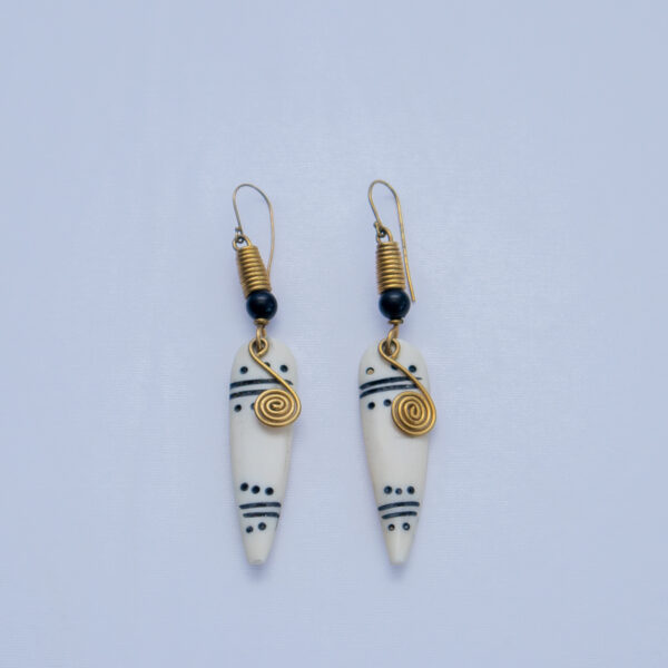Beautiful bone earrings with tribal patterns and brass wire detail. Simple and elegant.