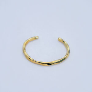 Adjustable minimalistic brass bracelet with an elegant finish.