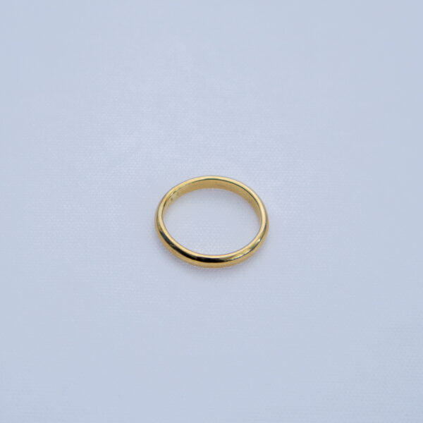 Classic brass wedding band with a smooth finish.
