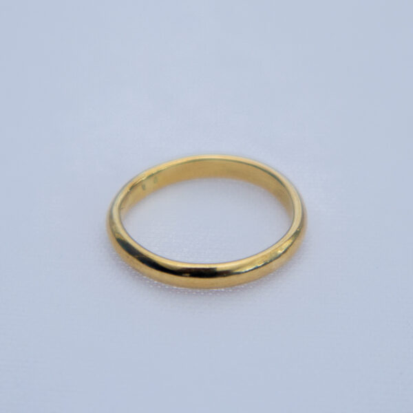 Classic brass wedding band with a smooth finish.