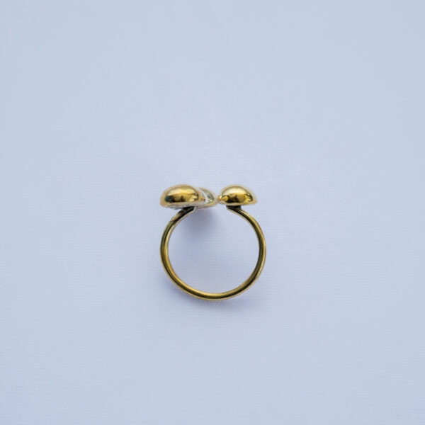 Rear view of the Open ended brass ring with subtle three dot design. Simple and adjustable.