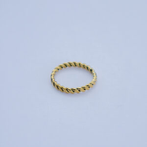 Minimalistic brass ring with rope-like twisted design and a smooth texture.