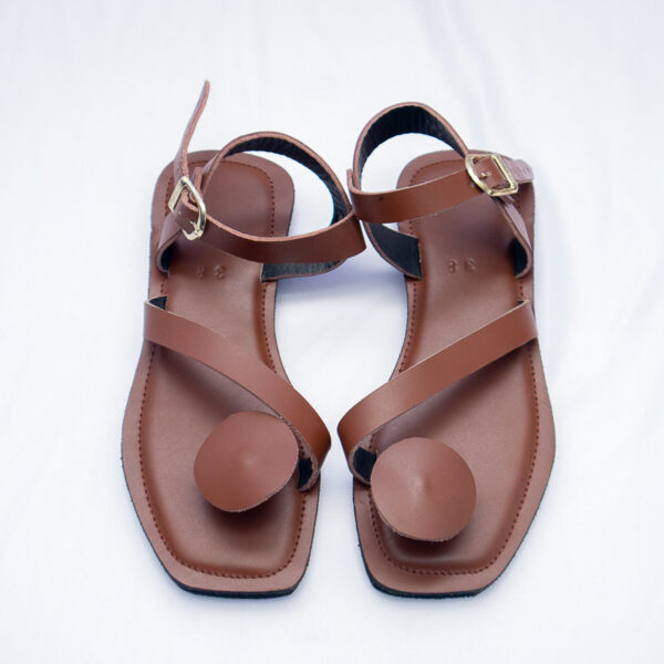 Brown leather flat sandals for women. They are comfortable,stylish with adjustable straps.