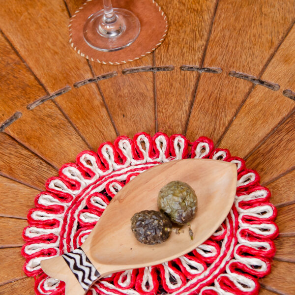 Decorative red and white handpainted coaster with a unique pattern.Made from sisal.