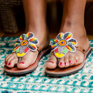 Afrostyled women's leather sandals with detailed multicolored bead design for a bold look.