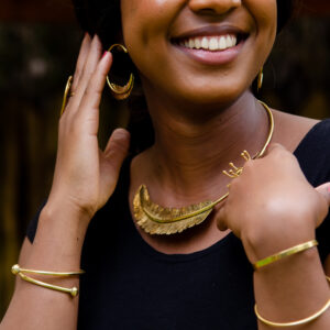 Handcrafted feather detail statement choker and earrings. Made from pure brass with a shiny finish