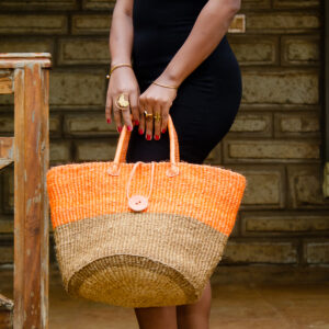 Multipurpose kiondoo bag, handwoven from sisal with leather accents.