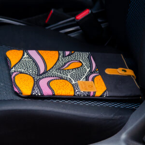 Bright coloured ankara fabric inserted in canvas iPad sleeve and leather closure