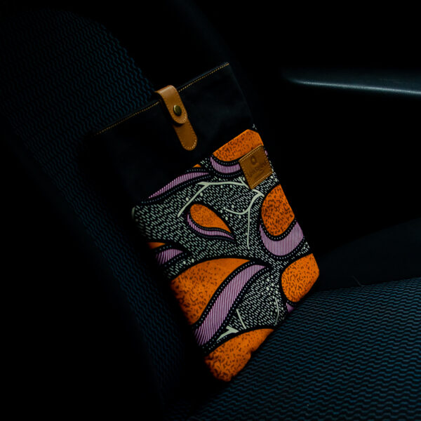 Bright coloured ankara fabric inserted in canvas iPad sleeve and leather closure