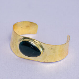 Handcrafted bracelet made with bold textured design and recycled black glass.