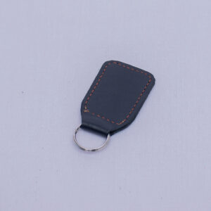 Handcrafted AfroStyled leather keychains available in multiple designs, with optional personalized customization at an additional cost.