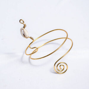 Handcrafted spiral wire cuff armlet with cowrie shell detail.