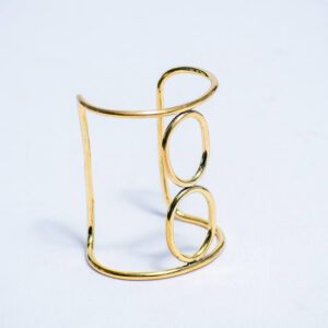 Handmade open brass cuff with circular designs in the middle for a classy look.