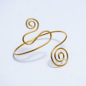 Handmade brass armlet with spiral design.