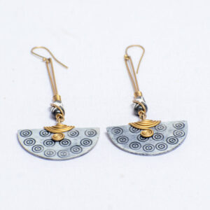 Handcrafted earrings featuring bone accents and sculptural brass wirework.