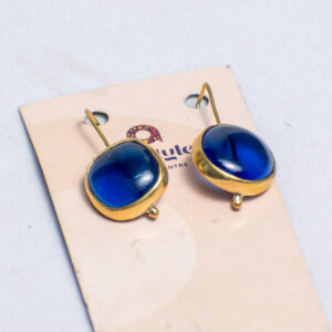 Dangling brass earrings with blue beads made from recycled glass.