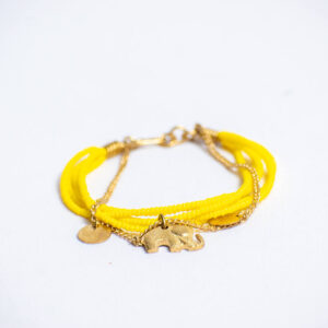 Yellow glass beaded bracelet with a brass chain link and an elephant-shaped brass charm.