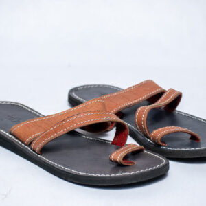 Brown leather toe-loop sandals with cross straps and stitched grip soles.