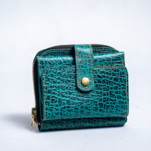 Blue wallet with crocodile texture,snap strap closure,bottom zipper and card slots inside.