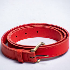 Red leather belt with visible well stitching and a metallic buckle.