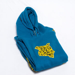 Folded blue kids hoodie with yellow and black fabric map of Kenya on the front.