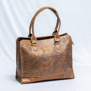 Brown leather handbag with sturdy handles,has compartments on the inside and a textured finish.