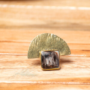 Handcrafted adjustable brass statement ring featuring a textured fan-shaped brass accent and a square polished horn inlay with natural marbled tones.