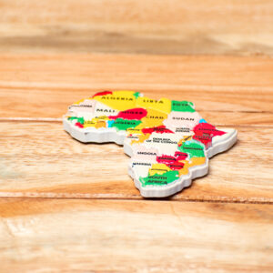 A continent-shaped fridge magnet displaying a colorful political map of Africa with country names printed on a multi-colored background.