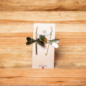 A pair of handcrafted golden brass drop earrings shaped like abstract dragonflies, featuring textured, hammered wings layered over long, narrow vertical brass bars.