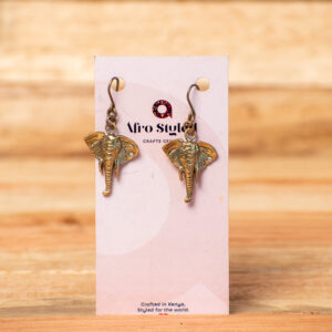 A pair of handcrafted golden brass drop earrings shaped like highly detailed elephant heads with textured ears, tusks, and long trunks.